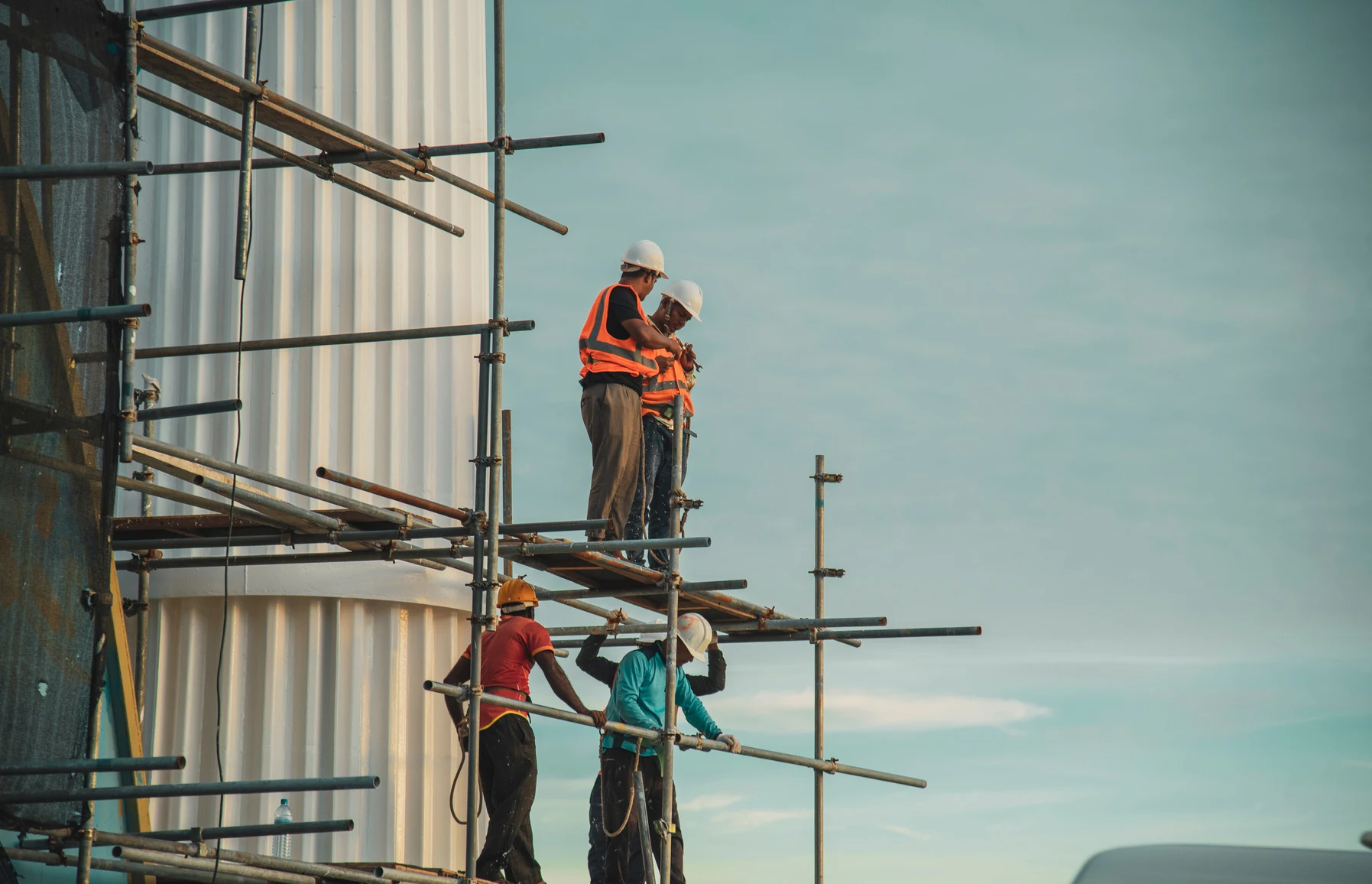 Construction workers on scaffolding